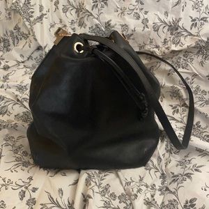 Auxiliary black leather bucket bag size large.